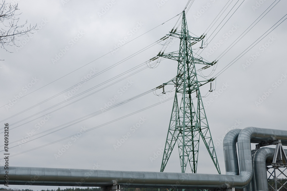 pipeline and power lines against the background of a gray sky pipeline and power lines against the background of a gray sky