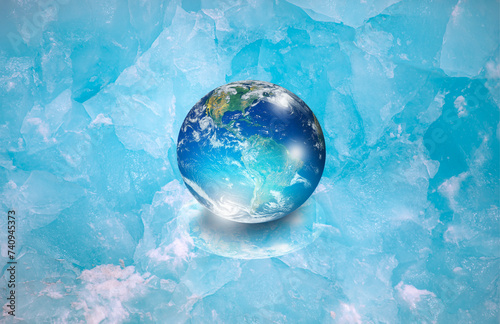 Ice age concept - Glass Globe (planet earth) on transparent ice \