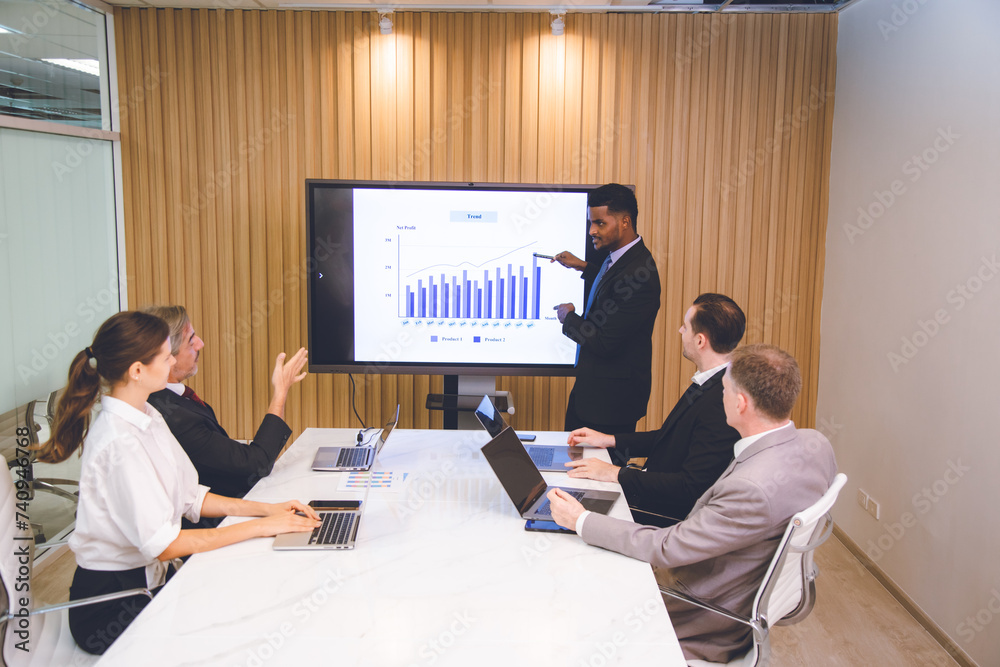 Fototapeta premium Professional diverse business people having collaboration team meeting in an office, technology and workers, men or employees with touchscreen planning sales, research or financial strategy in company
