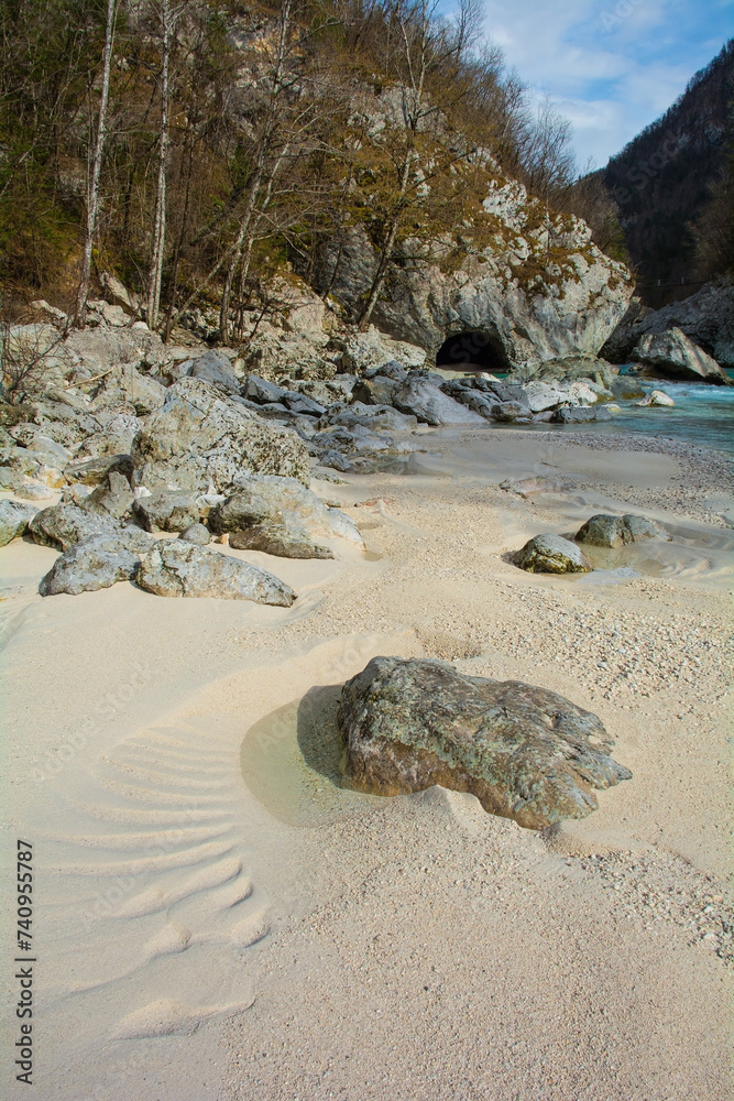 Obraz premium The Soca River near Kal-Koritnica in the Bovec municipality of the Primorska or Littoral region, north west Slovenia. This Alpine river flows from the Trenta Valley in the Julian Alps, entering Italy 