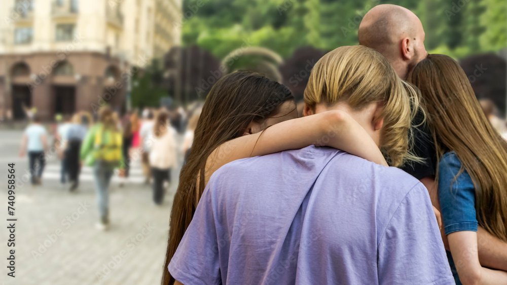 Young people hugging on the street Young people hugging on the street