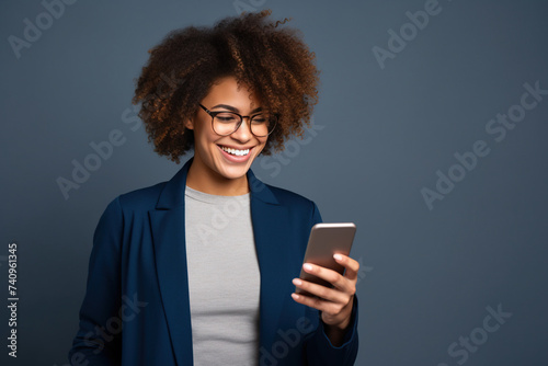 Wallpaper Mural Happy African American woman with phone on Navy studio background Torontodigital.ca