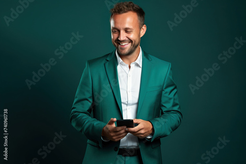 Man with phone on Forest Green studio background © AI_images