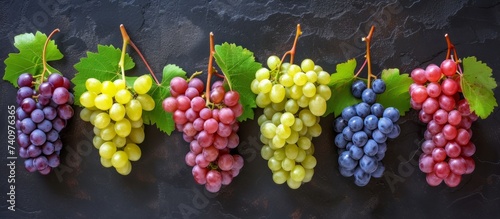 Grapes are a type of fruit that grows on vines and comes in many different varieties. They are seedless fruit, and their leaves are commonly used in Mediterranean cuisine photo
