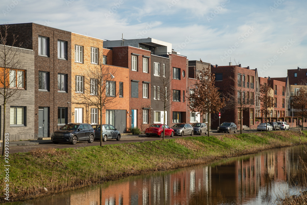 New modern residential buildings along the canal in the Vathorst district in Amersfoort.