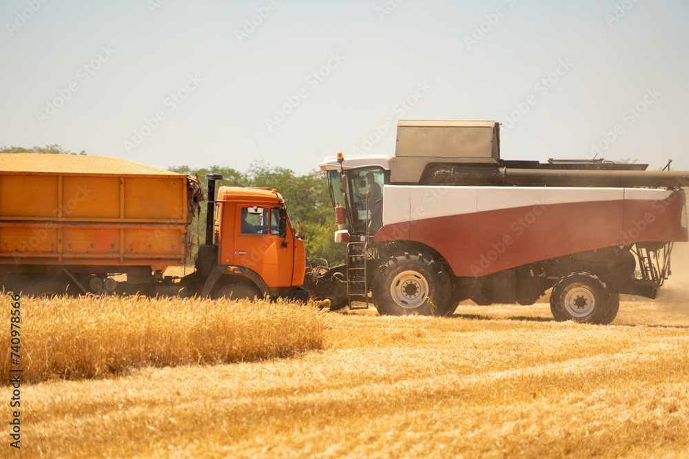 Combine harvester on the wheat field Combine harvester on the wheat field