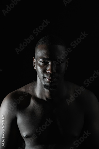 close-up of an African-American man's face on a black background with 90-degree illumination