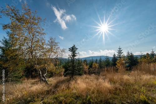 Autumn panorama of mountains and forests with a view of the sunset and forests with autumn colors of trees in the Jizera mountains in the Czech Republic