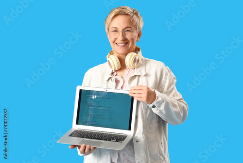 Smiling woman with headphon...