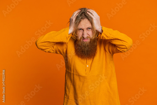 Obraz na plátně Sad young Caucasian man feeling hopelessness loneliness, nervous breakdown, loses becoming surprised by lottery results, bad fortune, loss unlucky news