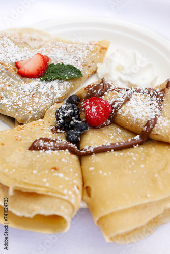 Nutella Crepes with Blueberry and Strawberry on Top Serve for Dessert, Italy