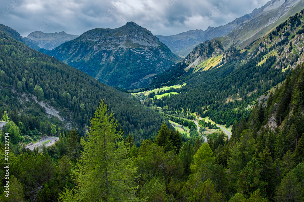 Sun breaking through the clouds brightens the Maloja Pass valley Sun breaking through the clouds brightens the Maloja Pass valley