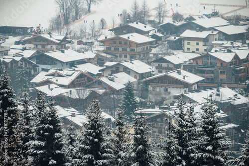 heavy snowfall in a ski resort in Austria, big snowflakes, houses covered with snow 