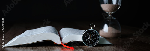 Book, compass and hourglass
