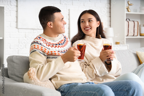Happy couple with glasses o...
