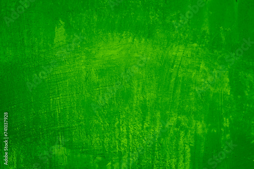 Bright green yellow abstract texture background. Oil paint on the wall. Rough brush strokes, smudges, drips, leak. Grunge rough dirty grain. Design.