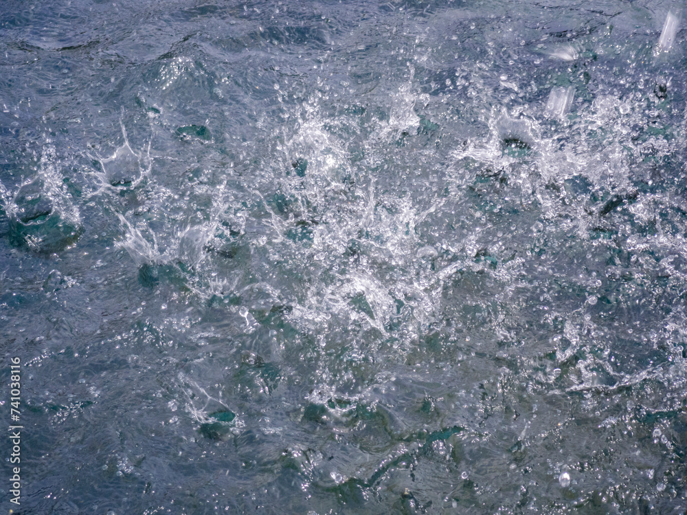 The raindrops of heavy rain on asphalt. Splashes from the rain The raindrops of heavy rain on asphalt. Splashes from the rain