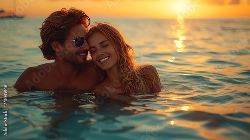 Couple Embracing in Sea at Sunset
