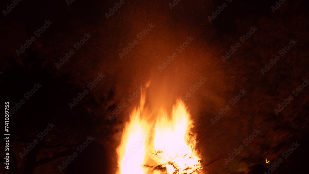 Bonfire with flames illuminating the surroundings. The image captures the practical elements of a bonfire scene, suitable for various purposes Bonfire with flames illuminating the surroundings. The image captures the practical elements of a bonfire scene, suitable for various purposes