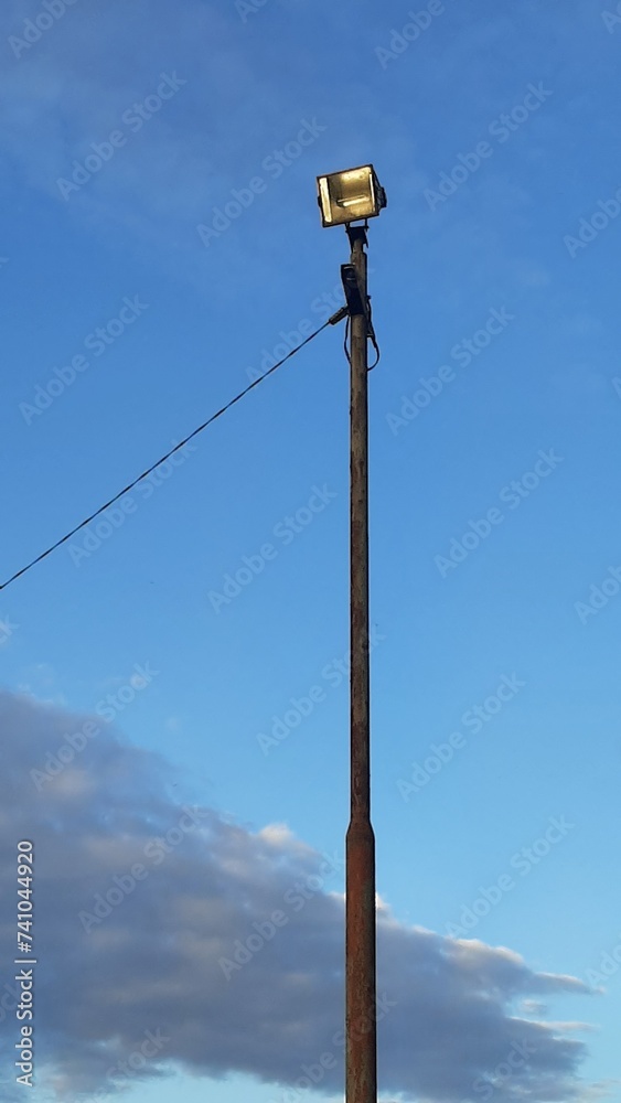 Street lamp post on blue sky background vertical format photography