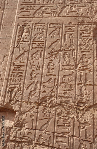 ancient egyptian hieroglyphics at the tomb of nobles in Aswan, Egypt 
