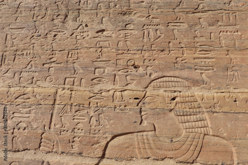 ancient egyptian carvings and hieroglyphics at tombs of nobles in Aswan, Egypt 