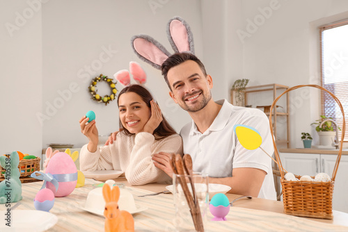 Happy couple in bunny ears ...