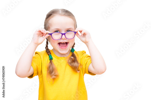 funny girl with glasses and a yellow T-shirt on a white background