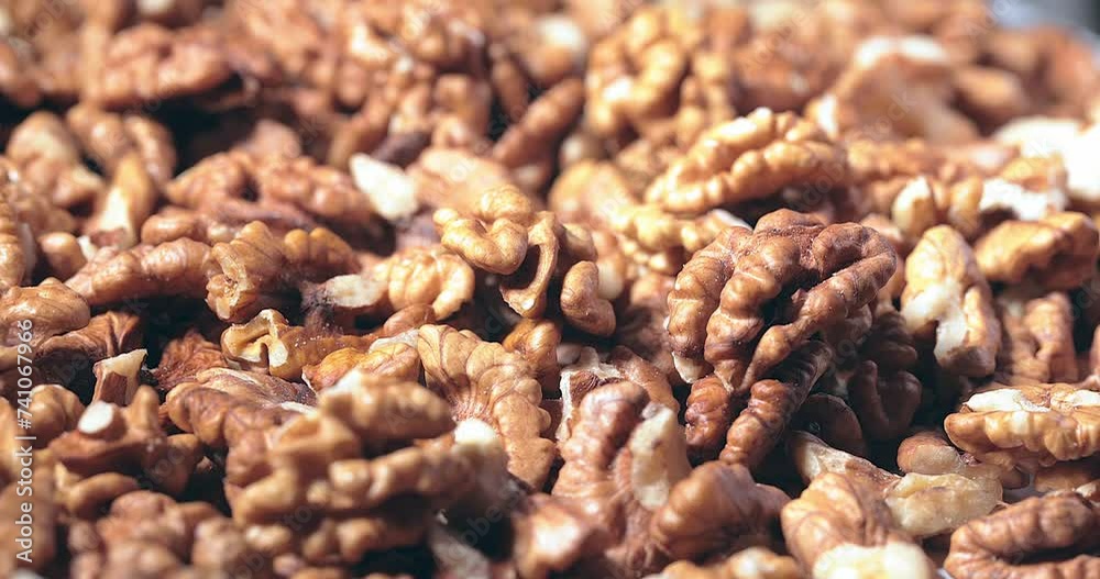 Walnut close up.product with minerals and vitamins, walnut turns in a table Walnut close up.product with minerals and vitamins, walnut turns in a table