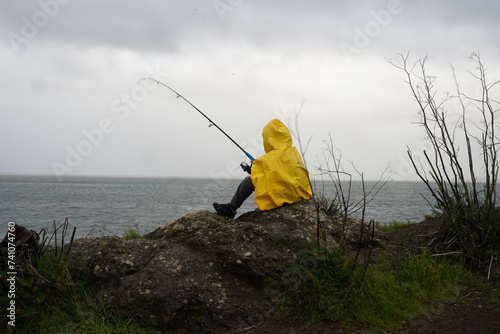 Fishing in a Yellow Rain Jacket