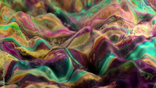 Vibrant, colorful, fluid and wavy abstract paint seamless loop animation. Modern and contemporary style in 4K with shades of green, yellow, orange, magenta, pink