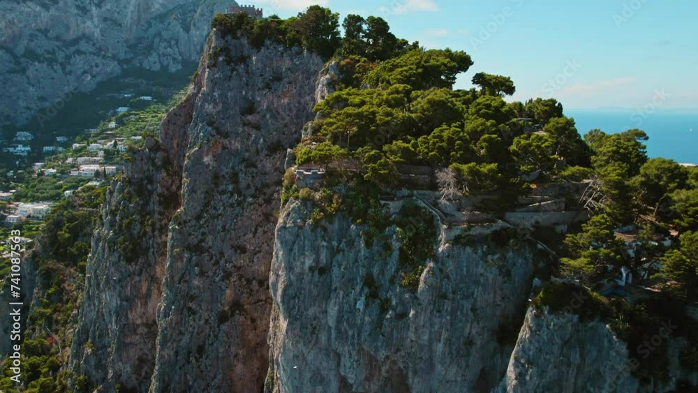 Cliffside Aerial View with Historic Buildings and Sea. Dramatic rocky coastline with historic settlement overlooking the seascape. Capri, Italy.