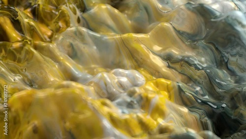 Vibrant, colorful, fluid and wavy abstract paint seamless loop animation. Modern and contemporary style in 4K with shades of yellow, white, black, orange
