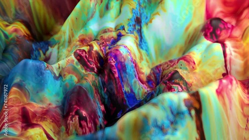 Vibrant, colorful, fluid and wavy abstract paint seamless loop animation. Modern and contemporary style in 4K with shades of green, purple, blue, cyan, yellow, red