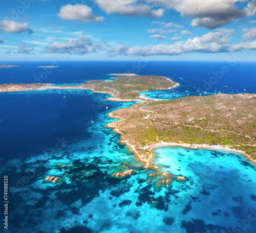 Aerial view of island, sea bay, yachts and boats at sunny day