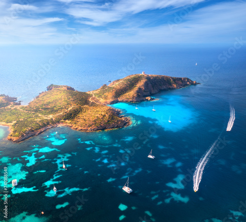 Fototapeta Naklejka Na Ścianę i Meble -  Aerial view of island, sea bay with clear azure water, boats