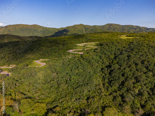 vista aerea desde el dron de un camino zigzagueante con vegetacion alrededor, La Merced, Catamarca, Argentina photo