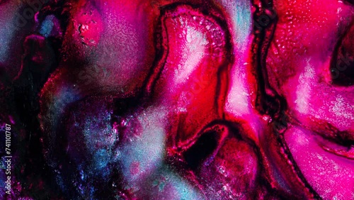 Vibrant, colorful, fluid and wavy abstract paint seamless loop animation. Modern and contemporary style in 4K with shades of red, magenta, pink, black