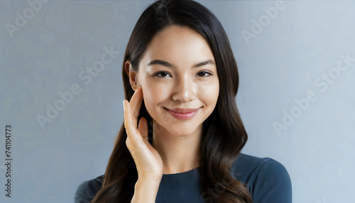 High-quality crop photo of skincare and cosmetics concept with copy space for text. Woman with beautiful face touching healthy facial skin portrait. Beautiful happy Asian girl model with natural face