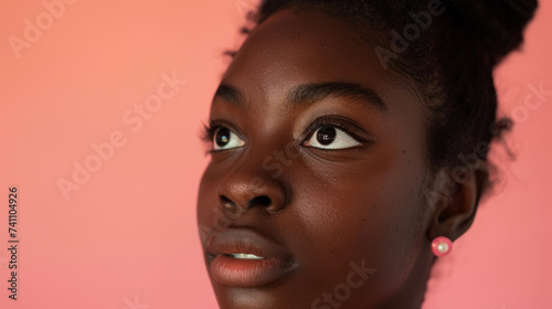 Close up Portrait of a female student against a pink studio background