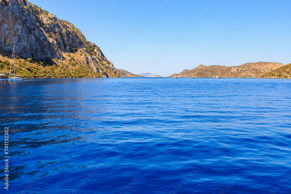 Beautiful nature with sea and mountains. Background with selective focus and copy space