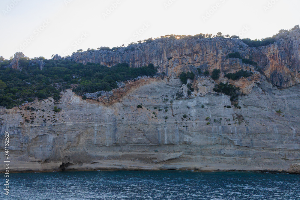 View of the rocky shore from the sea. Mediterranean Sea in Turkey. Popular tourist places. Background