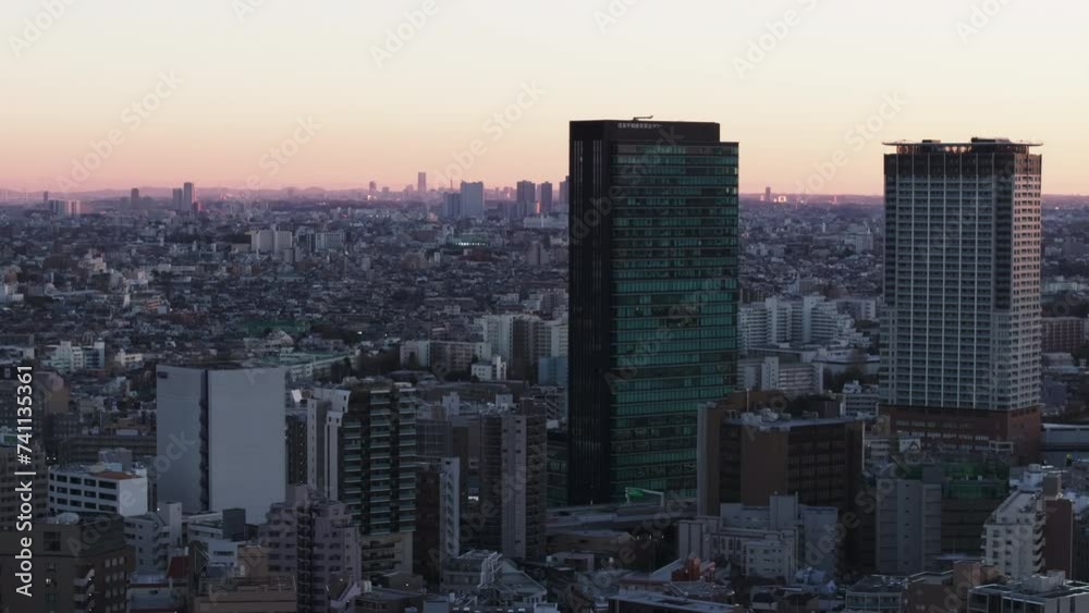 Aerial panoramic view of metropolis at twilight. Group of high rise building and cityscape. Tokyo, Japan Aerial panoramic view of metropolis at twilight. Group of high rise building and cityscape. Tokyo, Japan