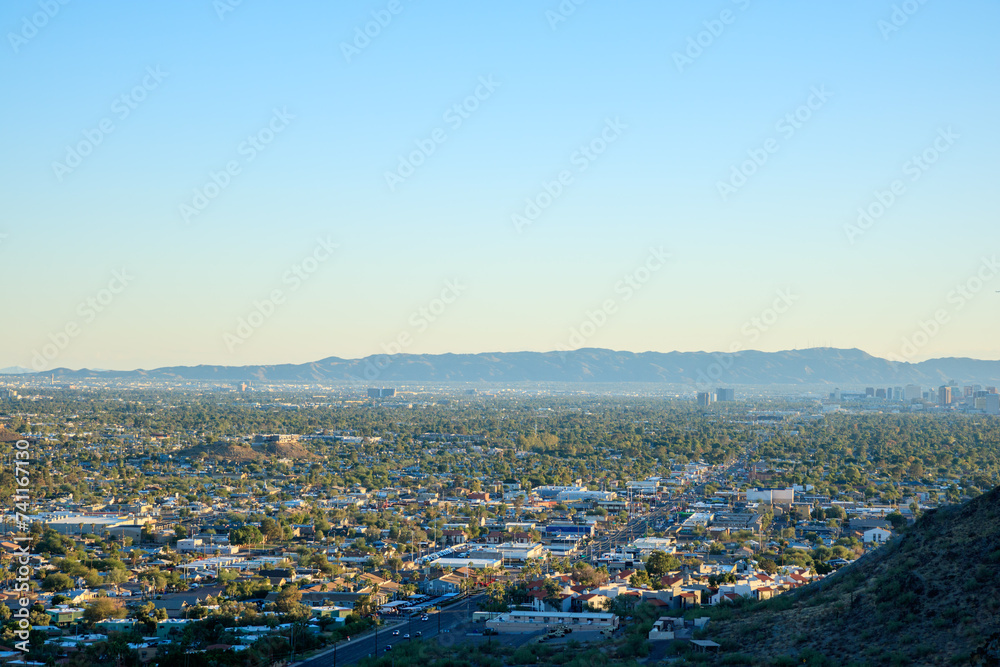 Arizona Valley of the Sun or Greater Phoenix Metro area as seen from North Mountain Park hiking trails toward South-East on late afternoon, copy space