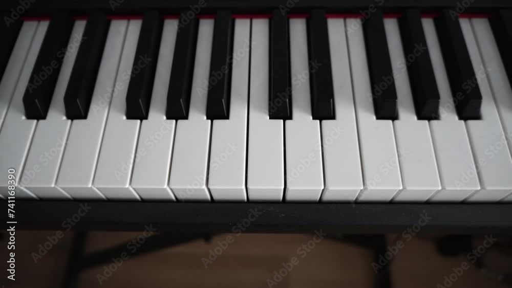 Closeup shot of the keyboard of a digital piano indoor in daylight with blur background Closeup shot of the keyboard of a digital piano indoor in daylight with blur background