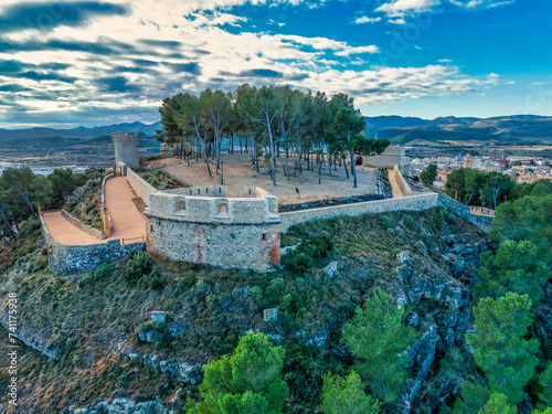 Aerial view of Segorbe castle, restored medieval hilltop stronghold with angled gun platform bastions on each corner, in Castello province Spain