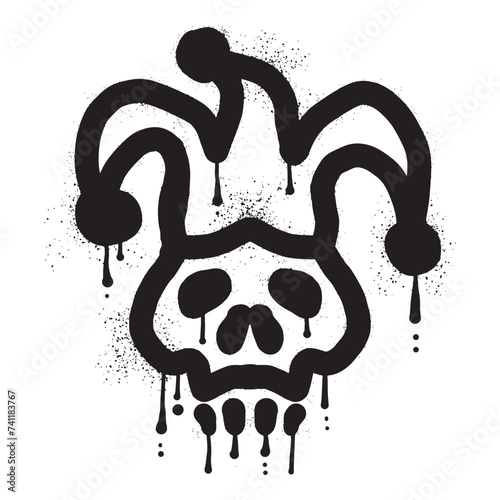 Skull with jester hat drawn with black spray paint