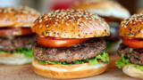 Delicious-looking burgers with fresh vegetables and grilled patties