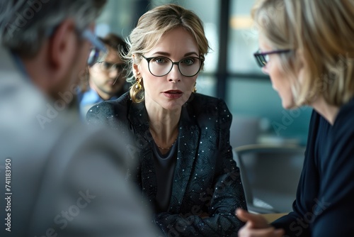 Confident professional businesswoman having lively discussion 