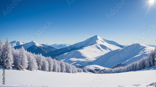 The view of the mountains covered in snow looks very beautiful with the bright blue sky. Mountain wallpapers © Eunoya